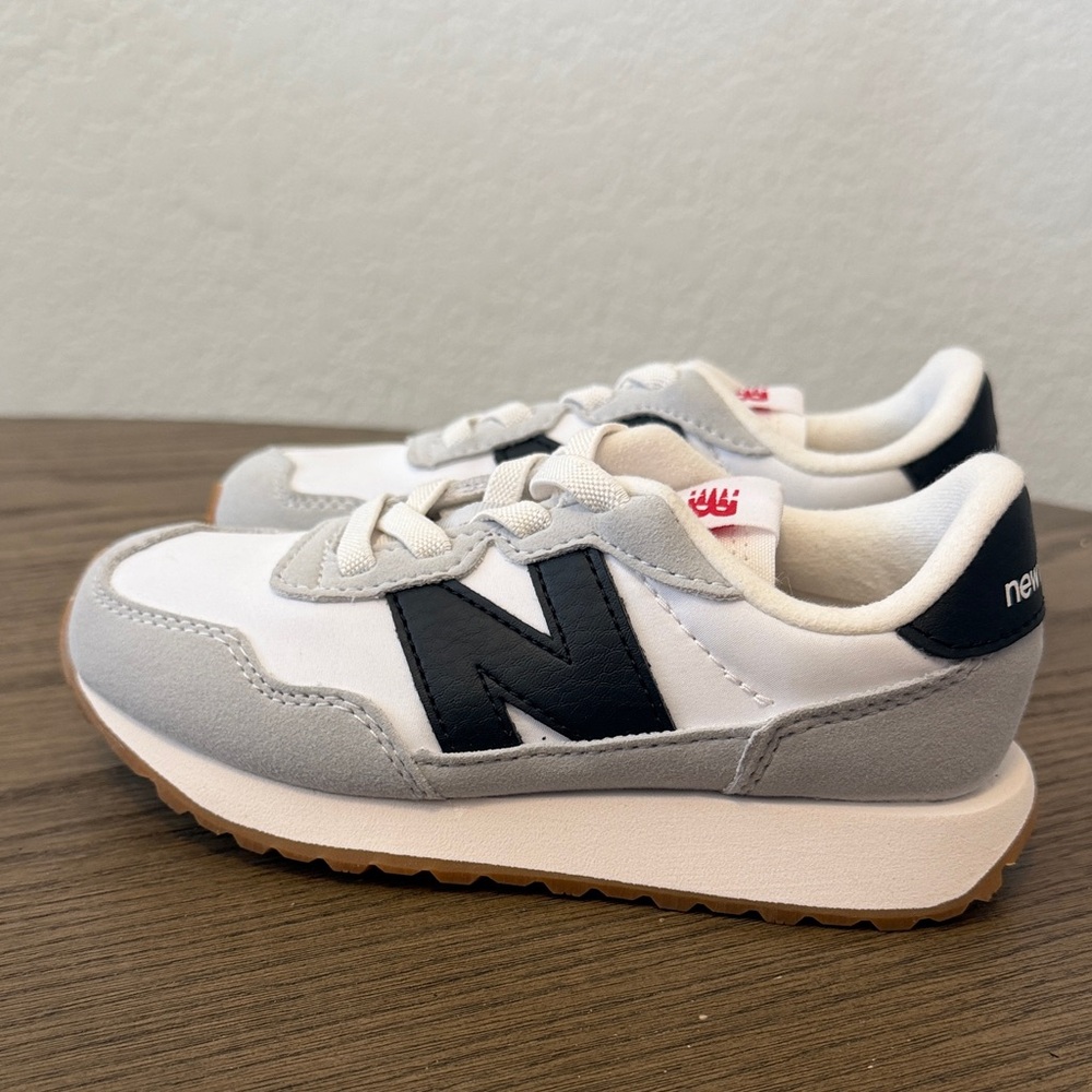 The New Balance Kids' 237 sneaker white/gray/black